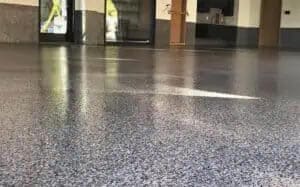 High gloss epoxy and polyaspartic concrete coated floor.
